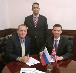 Mark Viner (left) signs the MOU with Pavel Nazarov. Standing by is Asim Ansari, Airedale's global key accounts manager